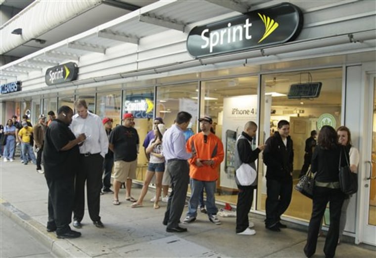 A line of people, wanting to purchase the new Apple iPhone 4S, wait in line for a Sprint store to open in San Francisco, Friday, Oct. 14, 2011. 